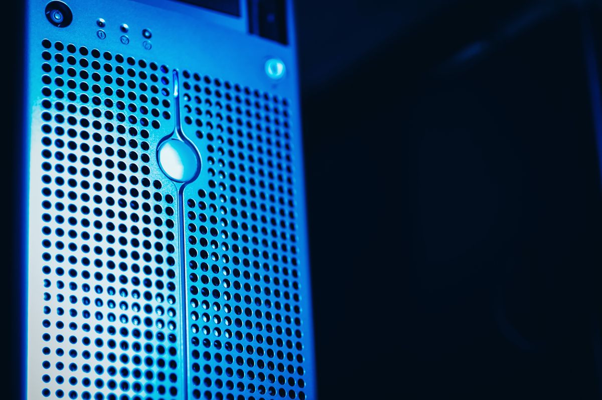 Close-up of server hardware and network connections in blue light. Editorial stock photograph.